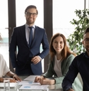 multi ethnic colleagues posing at work