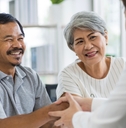 seniors talking to insurance staff