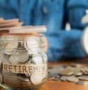 savings in jar with retirement label