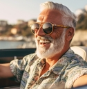 handsome senior man driving in italy