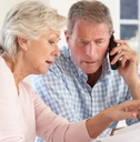 retired couple with household bills