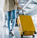 woman with luggage in airport