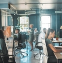  business people working in busy marketing office space