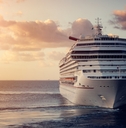 luxury cruise ship leaving port at sunset