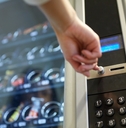person buying food from vending machine