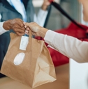 woman receives food delivery