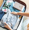 traveler packing her suitcase