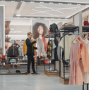 Costumers shopping, buying clothes and merchandise at checkout counter