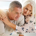 senior couple using laptop