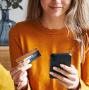 Happy woman shopping online with credit card