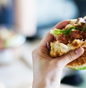 eating vegan meatless burger