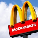 McDonalds logo on blue sky background