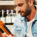 holding a bottle of wine