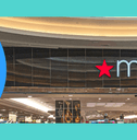 Macy&#x27;s exterior and shopping cart with bags