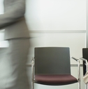 businesswoman sitting in busy waiting area