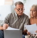 senior couple looking through papers