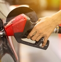 Pumping gas at gas pump