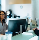 administrator assisting a woman