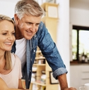 happy mature couple using laptop