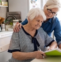elderly mother with paperwork