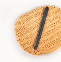 cuneiform clay tablet with stylus