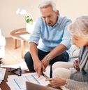 senior couple reviewing investment policy together