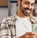 Worker counting dollars at office