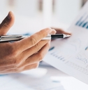 Businessman analyzing graphs at work