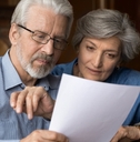 senior couple reviewing insurance policy together