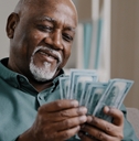 happy african american man counting money
