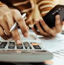 Female accountant making calculation