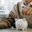 old man putting money coins 