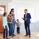 Realtor Showing Hispanic Family New Home