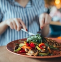 Woman in restaurant eating