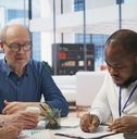 senior citizens consulting a broker