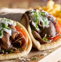 two greek gyros with shaved lamb 