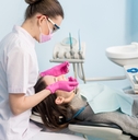 Female dentist with dental tools