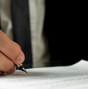 businessman signing a document
