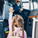 Little girl going into the bus