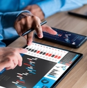 Businessman analyzing investment stock market