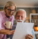 Couple reading a letter document