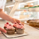 putting muffins on display 