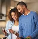 couple using a digital tablet