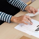 Senior Calculating financial at Home