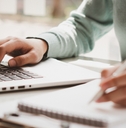 Business women work on computers