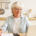 Senior paying electricity bills online