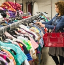 Female Shopper In Thrift Store