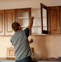 Carpenter working on new kitchen cabinets