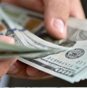 businessman counting banknotes in hand
