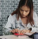 Woman using a calculator